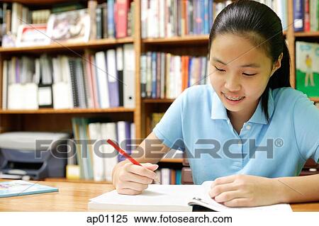 Girl doing homework View Large Photo Image Stock Photography - Girl doing homework. Fotosearch