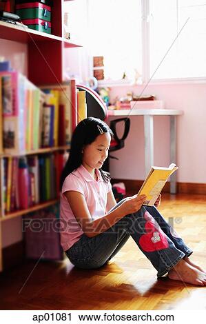 Girl sitting, reading book View Large Photo Image Stock Image - Girl sitting, reading book. Fotosearch