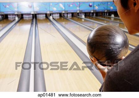 Stock Image - Man bowling. Fotosearch