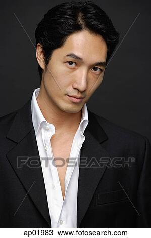 Man in white shirt and jacket, looking at camera, portrait View Large Photo Image Stock Image - Man in white shirt and jacket, looking at camera, portrait. Fotosearch