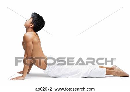 Man kneeling on floor in yoga position View Large Photo Image Stock Image - Man kneeling on floor in yoga position. Fotosearch