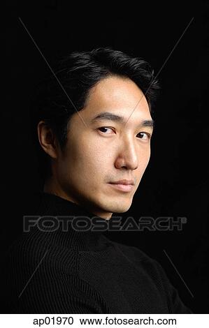 Man looking at camera, black background View Large Photo Image Stock Image - Man looking at camera, black background. Fotosearch