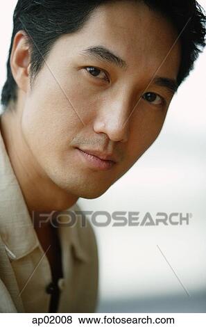 Man looking at camera, head shot View Large Photo Image Stock Photo - Man looking at camera, head shot. Fotosearch