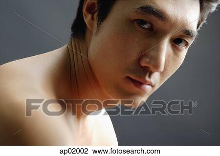Man looking at camera, semi-dressed View Large Photo Image Stock Image - Man looking at camera, semi-dressed. Fotosearch