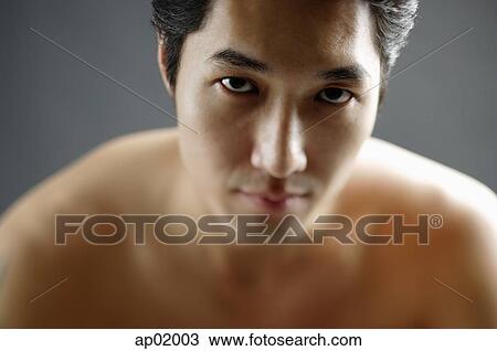 Man looking at camera, semi-dressed, portrait View Large Photo Image Stock Image - Man looking at camera, semi-dressed, portrait. Fotosearch