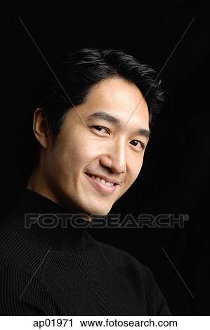 Man looking at camera, smiling View Large Photo Image Stock Image - Man looking at camera, smiling. Fotosearch