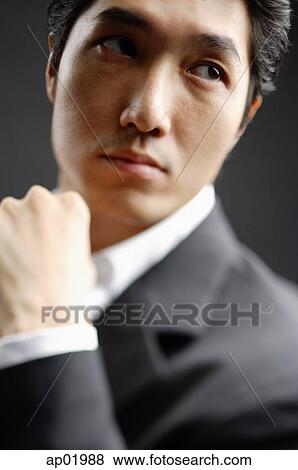 Man looking away, head shot View Large Photo Image Stock Photo - Man looking away, head shot. Fotosearch