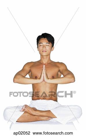 Man practicing yoga, hands together View Large Photo Image Stock Image - Man practicing yoga, hands together. Fotosearch