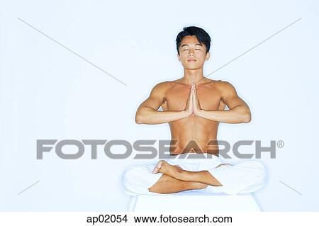 Man practicing yoga, meditating View Large Photo Image Picture - Man practicing yoga, meditating. Fotosearch