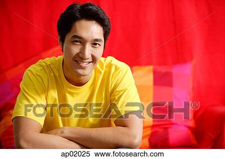 Man smiling at camera, arms crossed View Large Photo Image Stock Photography - Man smiling at camera, arms crossed. Fotosearch
