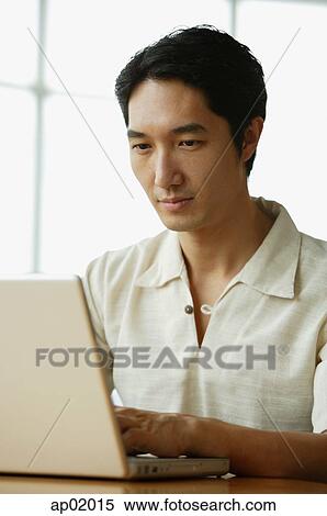 Man using laptop View Large Photo Image Stock Photography - Man using laptop. Fotosearch