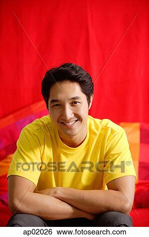 Man with arms crossed, smiling, portrait View Large Photo Image Stock Photograph - Man with arms crossed, smiling, portrait. Fotosearch