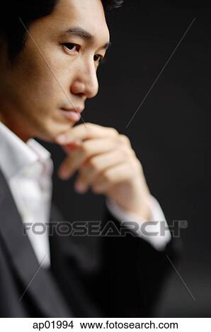 Man with hand on chin View Large Photo Image Picture - Man with hand on chin. Fotosearch