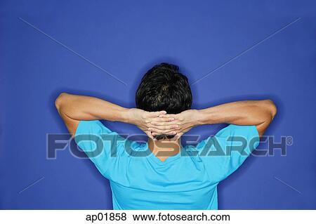 Man with hands behind head, rearview View Large Photo Image Stock Photo - Man with hands behind head, rearview. Fotosearch