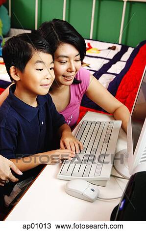 Mother and son using computer View Large Photo Image Stock Image - Mother and son using computer. Fotosearch
