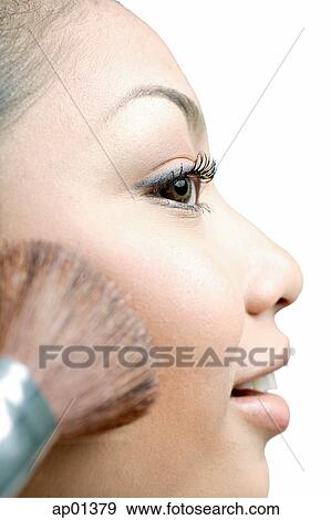 Woman applying blusher with make-up brush, profile View Large Photo Image Stock Photo - Woman applying blusher with make-up brush, profile. Fotosearch