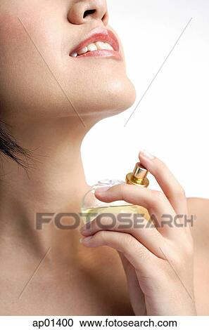 Woman applying perfume View Large Photo Image Stock Image - Woman applying perfume. Fotosearch