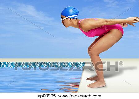 Woman bending, preparing to dive into swimming pool View Large Photo Image Stock Photography - Woman bending, preparing to dive into swimming pool. Fotosearch