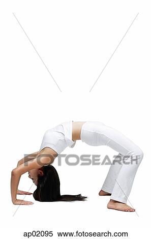 Stock Photography - Woman doing yoga, bending over backwards. Fotosearch