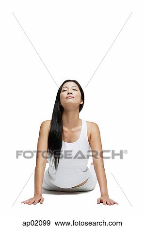 Stock Photo - Woman doing yoga, cobra position. Fotosearch