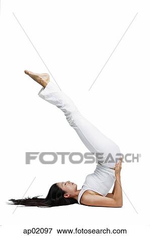 Woman doing yoga, shoulder stand position View Large Photo Image Stock Photo - Woman doing yoga, shoulder stand position. Fotosearch