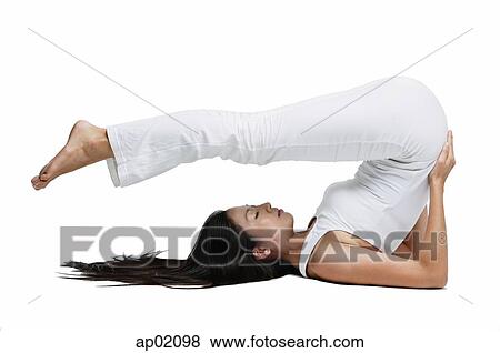 Woman doing yoga, shoulder stand position View Large Photo Image Stock Photo - Woman doing yoga, shoulder stand position. Fotosearch