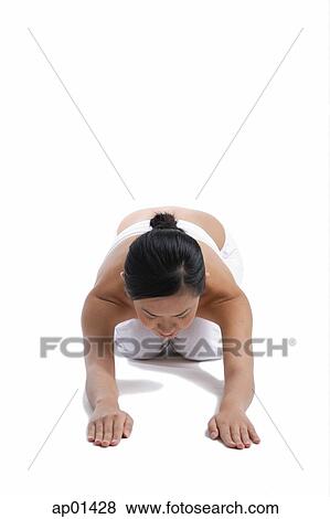 Stock Photo - Woman kneeling on floor. Fotosearch