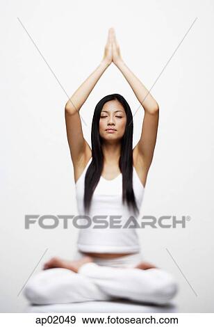 Stock Photo - Woman practicing yoga. Fotosearch