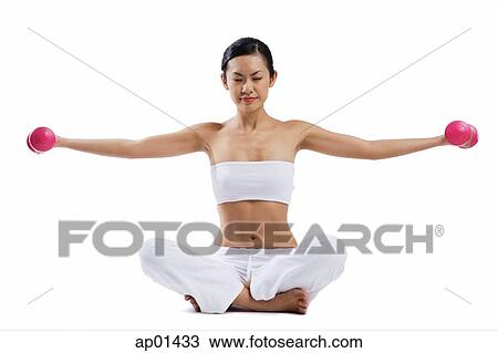 Woman sitting on floor, legs crossed, lifting dumbbells View Large Photo Image Stock Image - Woman sitting on floor, legs crossed, lifting dumbbells. Fotosearch