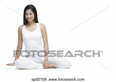 Woman sitting on floor, looking at camera, smiling View Large Photo Image Stock Photo - Woman sitting on floor, looking at camera, smiling. Fotosearch
