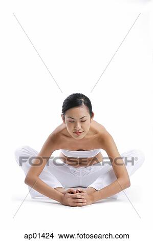 Woman sitting on floor, stretching View Large Photo Image Picture - Woman sitting on floor, stretching. Fotosearch