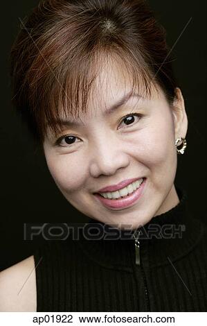 Woman smiling at camera, head shot View Large Photo Image Stock Image - Woman smiling at camera, head shot. Fotosearch