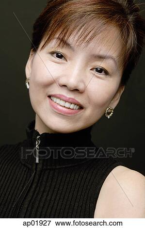 Stock Photo - Woman smiling, head shot. Fotosearch