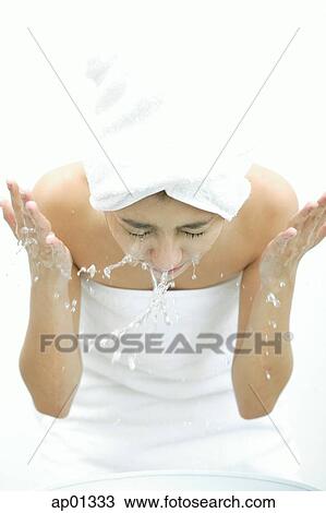 Woman washing her face, splashing water View Large Photo Image Stock Image - Woman washing her face, splashing water. Fotosearch