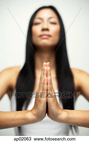Woman with eyes closed, hands together View Large Photo Image Stock Image - Woman with eyes closed, hands together. Fotosearch