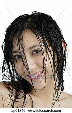Woman with wet hair, looking at camera, smiling View Large Photo Image Stock Image - Woman with wet hair, looking at camera, smiling. Fotosearch