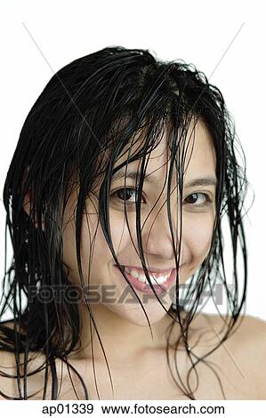 Woman with wet hair, smiling at camera View Large Photo Image Stock Photo - Woman with wet hair, smiling at camera. Fotosearch