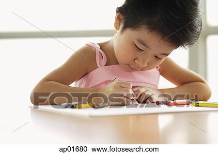 Young girl drawing using crayons View Large Photo Image Stock Image - Young girl drawing using crayons. Fotosearch
