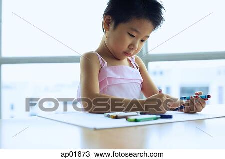 Young girl drawing with crayons View Large Photo Image Stock Image - Young girl drawing with crayons. Fotosearch