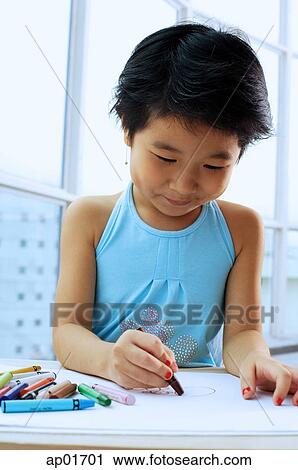 Young girl drawing with crayons View Large Photo Image Stock Image - Young girl drawing with crayons. Fotosearch