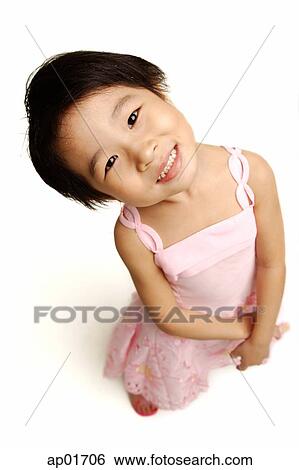 Young girl in pink dress, looking at camera, high angle view View Large Photo Image Stock Photograph - Young girl in pink dress, looking at camera, high angle view. Fotosearch