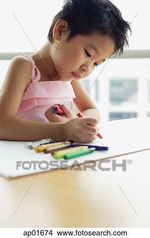 Young girl with crayons, drawing View Large Photo Image Picture - Young girl with crayons, drawing. Fotosearch