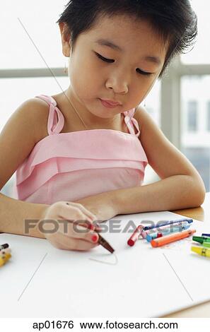Young girl with crayons, looking down View Large Photo Image Stock Photograph - Young girl with crayons, looking down. Fotosearch