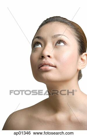 Young woman looking up View Large Photo Image Stock Photograph - Young woman looking up. Fotosearch