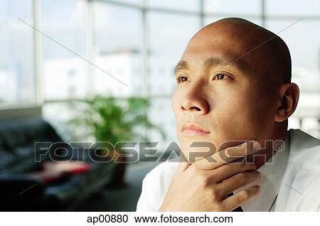 Bald executive, looking away, hand on chin View Large Photo Image Stock Image - Bald executive, looking away, hand on chin. Fotosearch