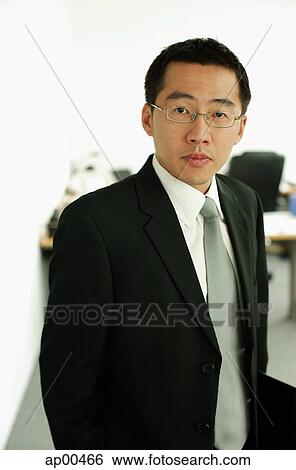 Businessman looking at camera, portrait View Large Photo Image Stock Photograph - Businessman looking at camera, portrait. Fotosearch