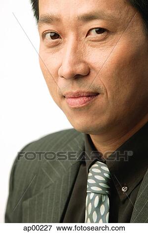 Stock Photo - Businessman looking at camera. Fotosearch