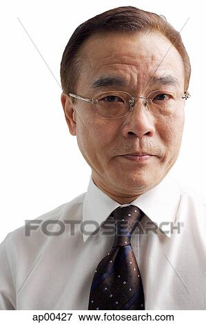 Stock Photo -  Businessman looking at camera. Fotosearch