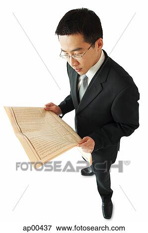 Stock Photo - Businessman reading newspaper. Fotosearch