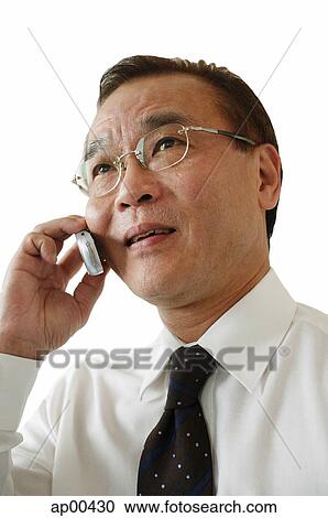 Businessman using mobile phone View Large Photo Image Stock Image - Businessman using mobile phone. Fotosearch